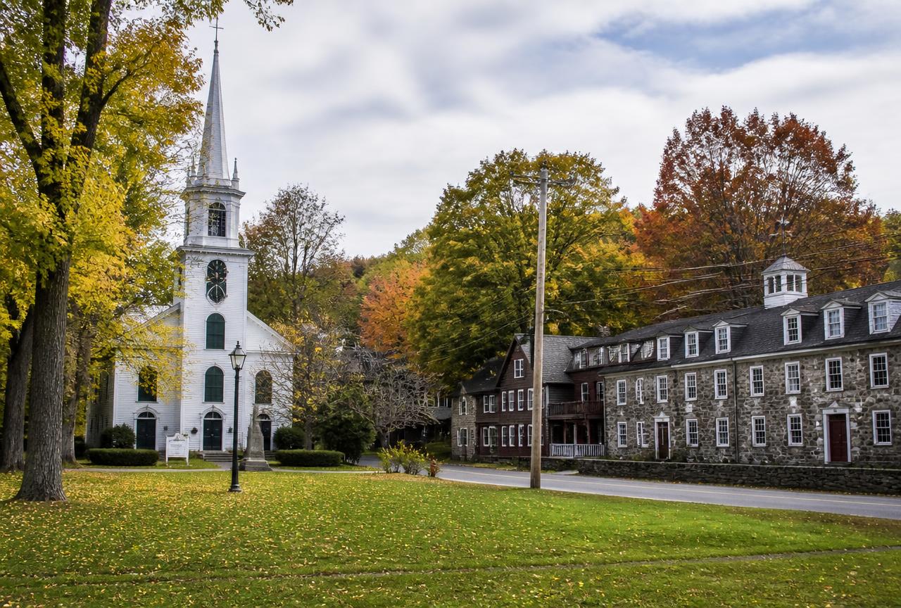 Slatersville village green with white church and stone mill in North Smithfield, Rhode Island
