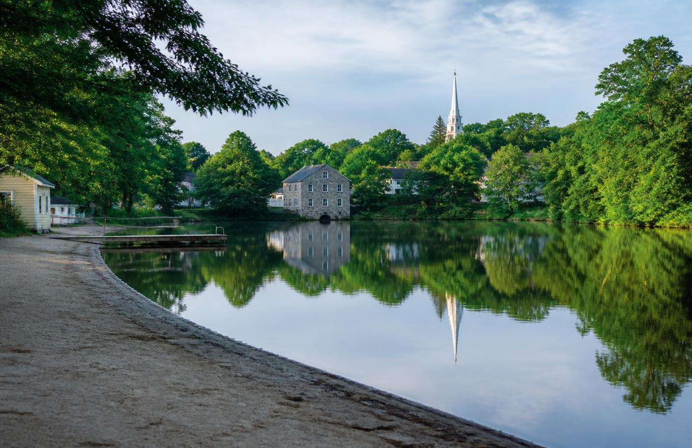 Georgiaville Pond town beach and historic stone mill in Smithfield, Rhode Island